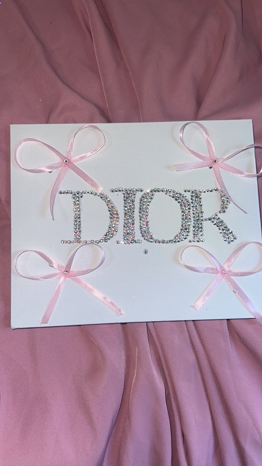 “DIOR” rhinestone canvas art with ribbons