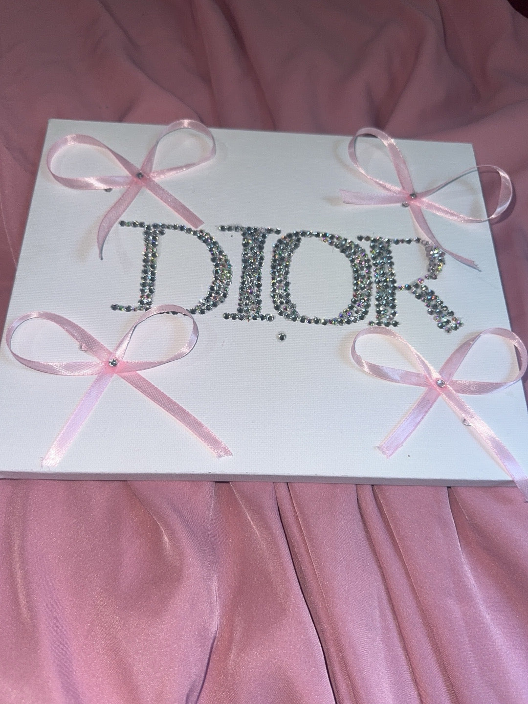 “DIOR” rhinestone canvas art with ribbons