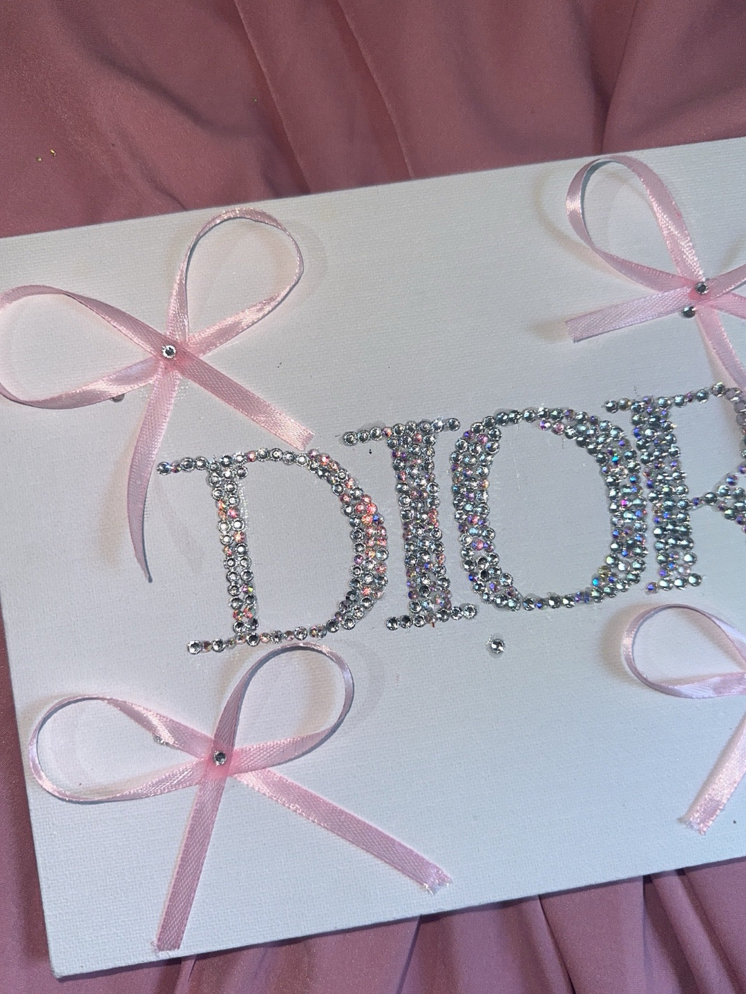 “DIOR” rhinestone canvas art with ribbons