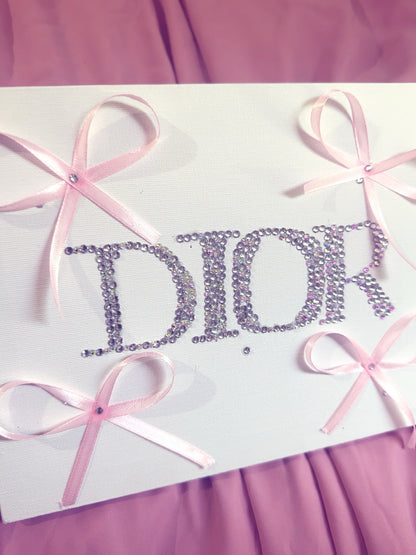 “DIOR” rhinestone canvas art with ribbons